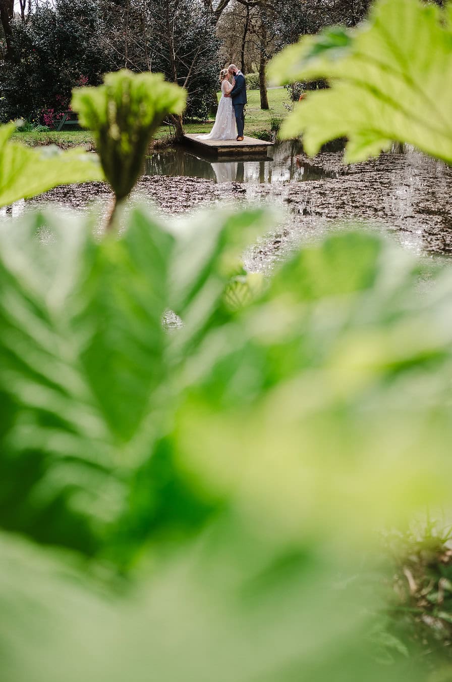 Couple around the beautiful green woodlands at Chycara, Cornwall - Average Wedding Photographer Cost