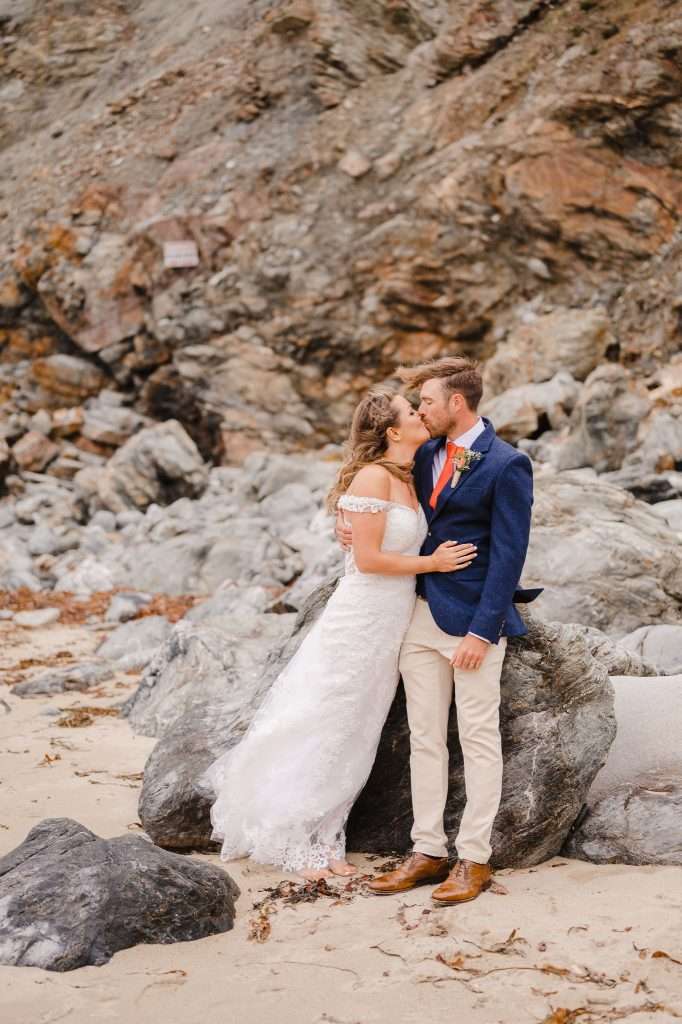 Couple portraits on the beach Driftwood Spars wedding venue - Trevaunance Cove