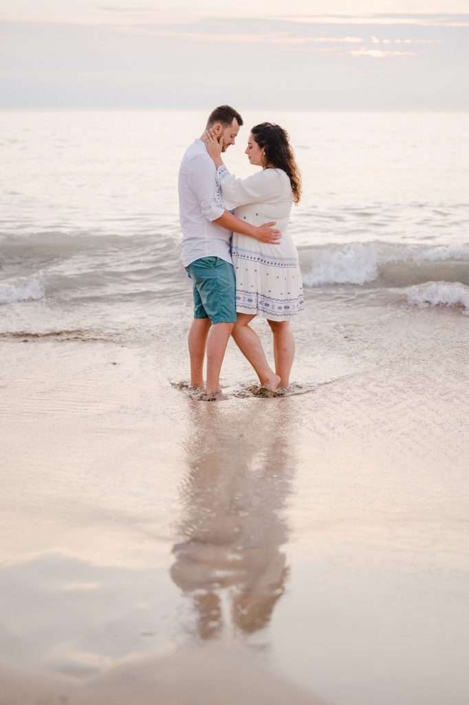Couple celebrating their engagement on a beautiful beach in Cornwall