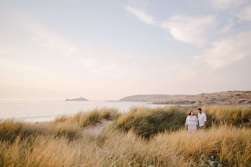 Engaged couple enjoying the sand dunes at Godrevy - What To Do Now You're Engaged