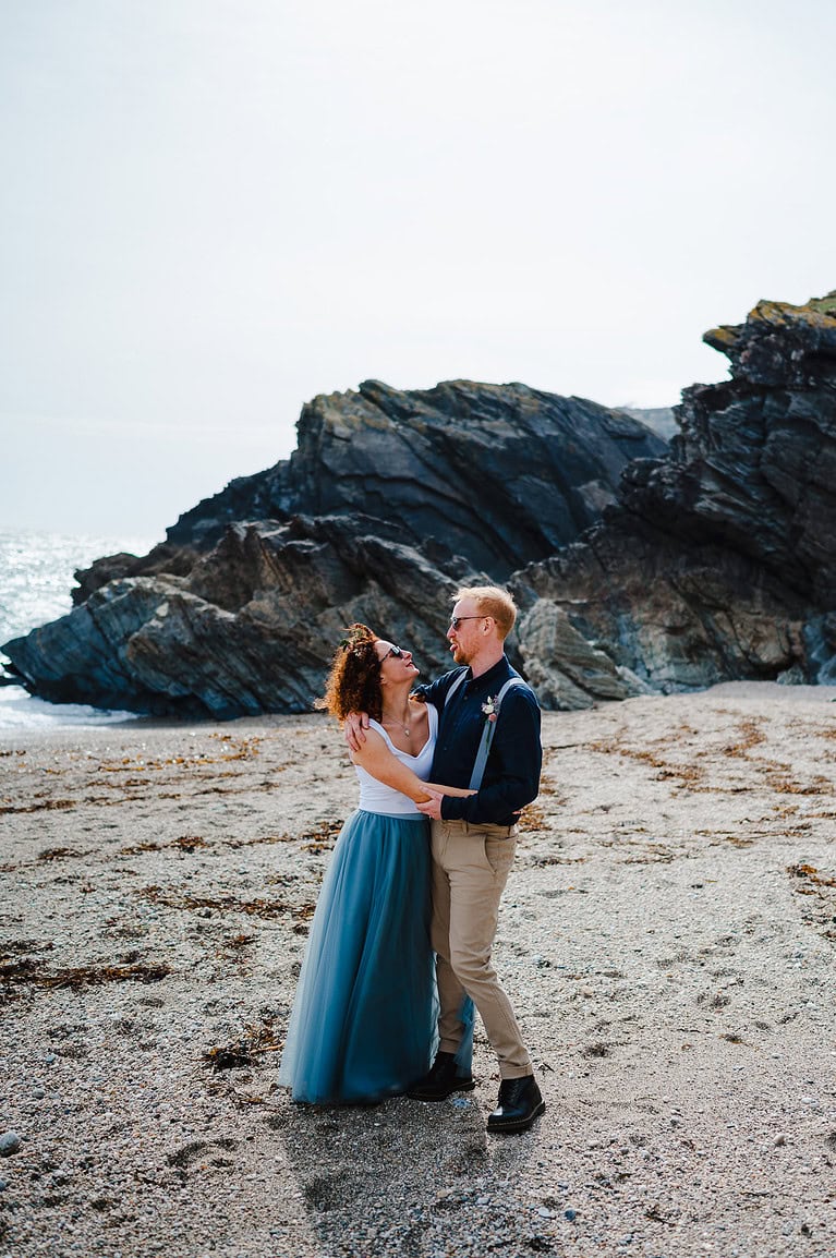 Couple pulling faces as they celebrate getting married