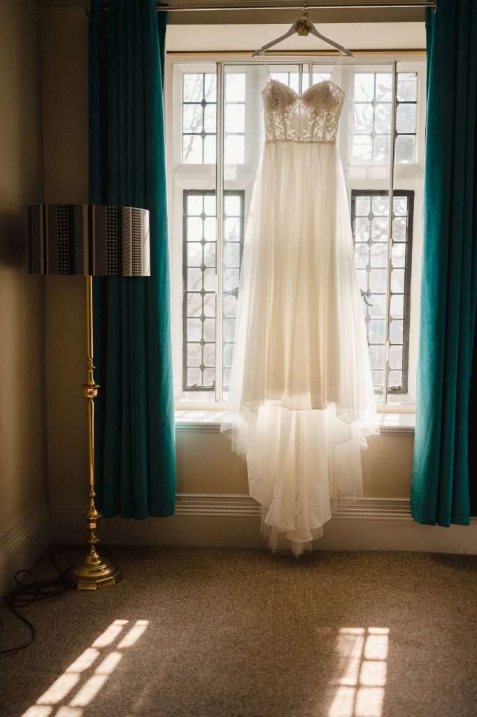 Wedding dress hung up in the window at the Alverton - 14 Tips to Help You Find the Perfect Wedding Dress