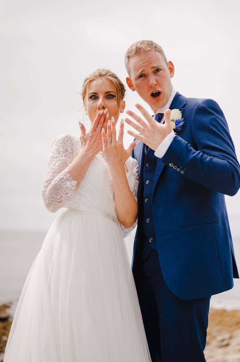 Wedding VS Elopement - The Difference - Couple posing with their rings