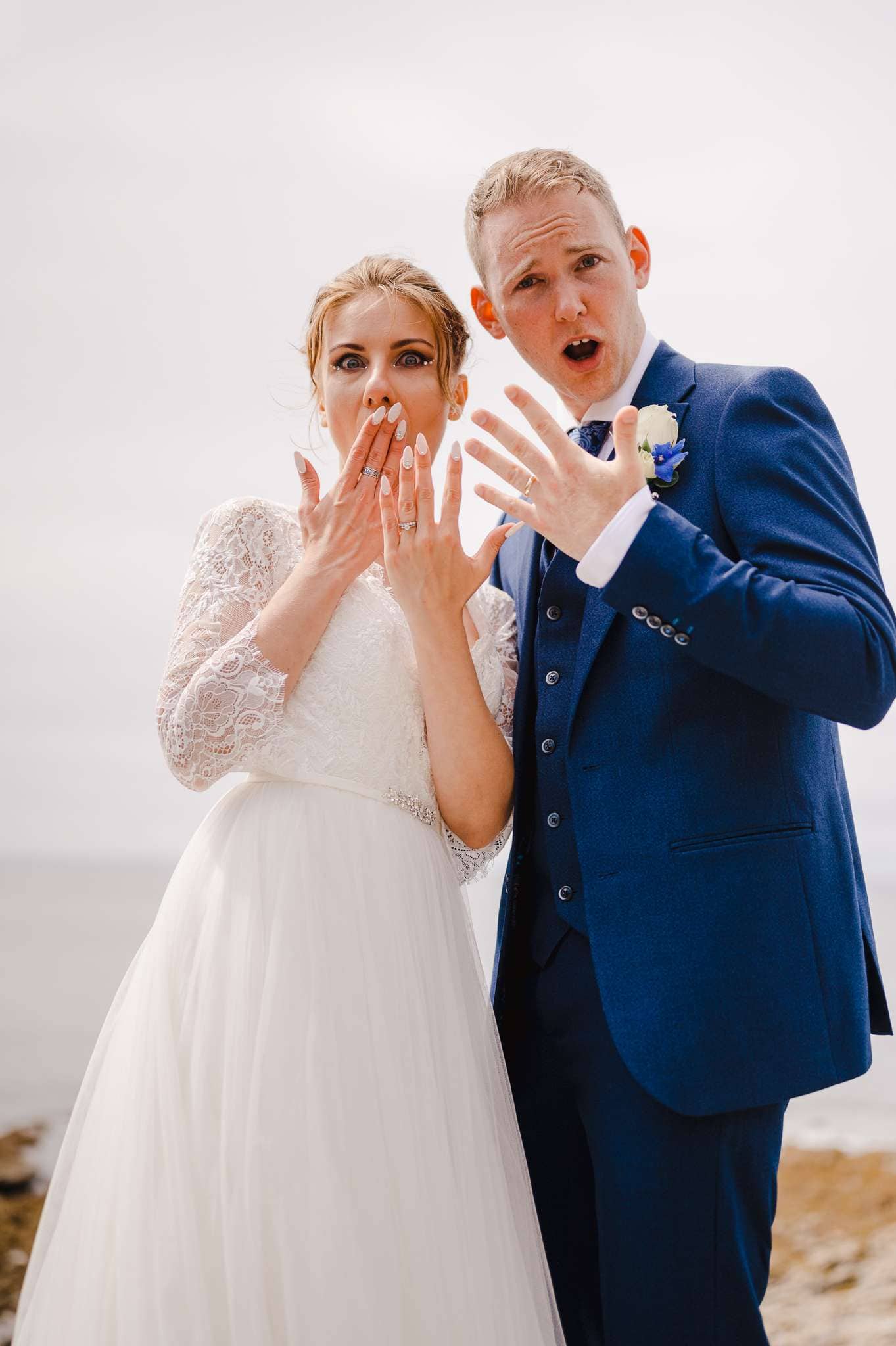 Wedding VS Elopement - The Difference - Couple posing with their rings