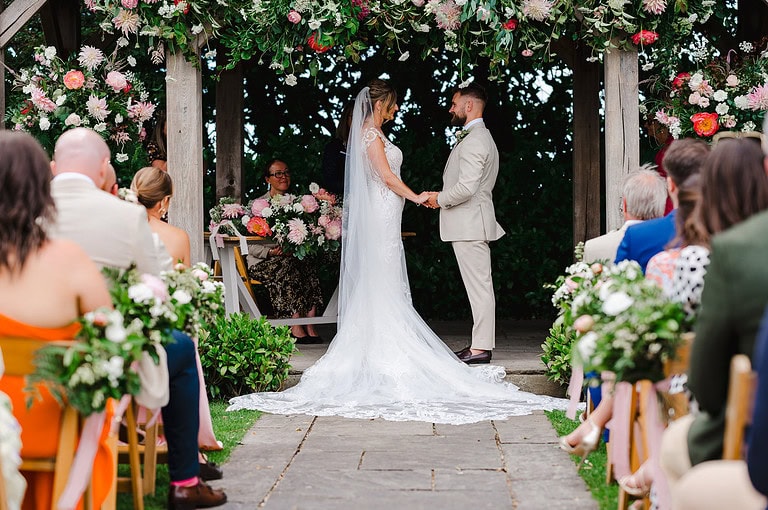 Wedding couple under the pagoda at Trevenna during their wedding ceremony - Top Wow Factor Wedding Venues in Cornwall and Devon