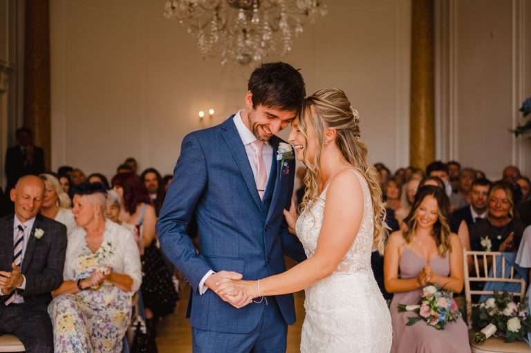 Wedding Couple laugh after seeing each other for the first time - Wedding Photographer: How To Choose The Right One For You?
