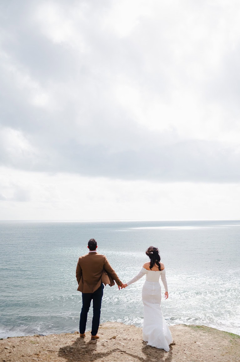 Looking out to sea on the couples elopement wedding in Cornwall