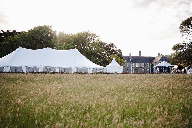 Wedding marquee in the golden sunset light at Rosteague Wedding Venue - The Questions To Ask Your Wedding Venue