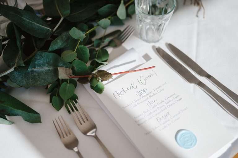 The wedding menu on the centre of the wedding table - The 5 Wedding Planning Apps