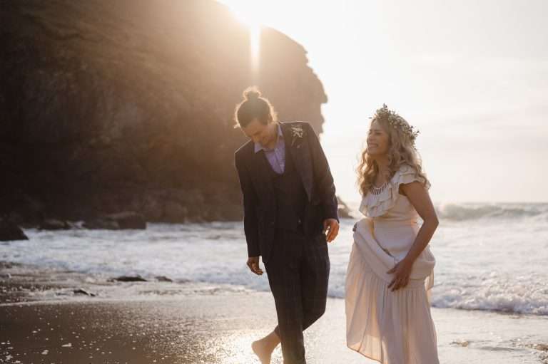 Elopement couple enjoy the sunset in Cornwall - Your Cornwall Elopement Guide