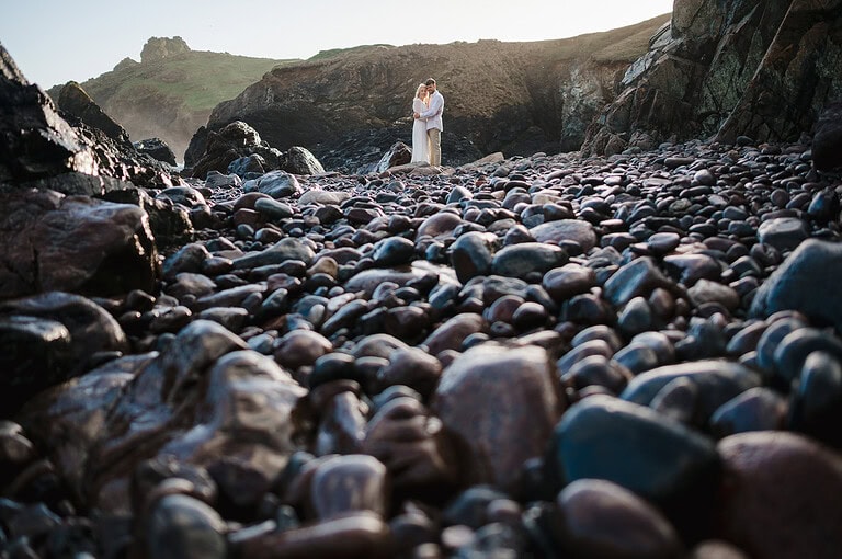 Couple enjoying the beauty of Kyncance Cove during an Engagement photoshoot at Kyncace cove