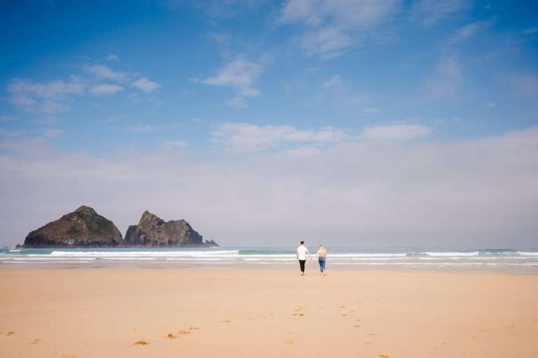 Walking along the beautiful Holywell Bay - Engagement Shoot - The Ultimate Guide -