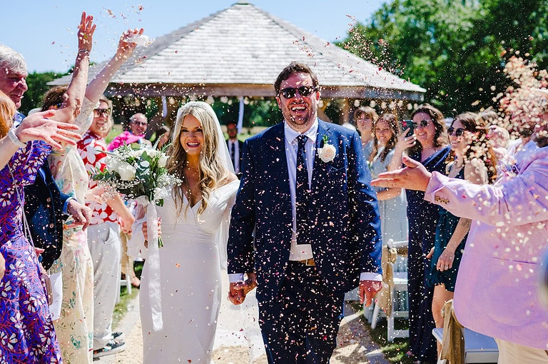 Biodegradable wedding confetti being thrown at an amazing Froginwell wedding