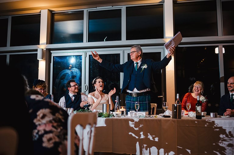 Father of the bride gets the crowd going as he is about to make his wedding speech - The Greatest Guide To Create a Unique Wedding Speech