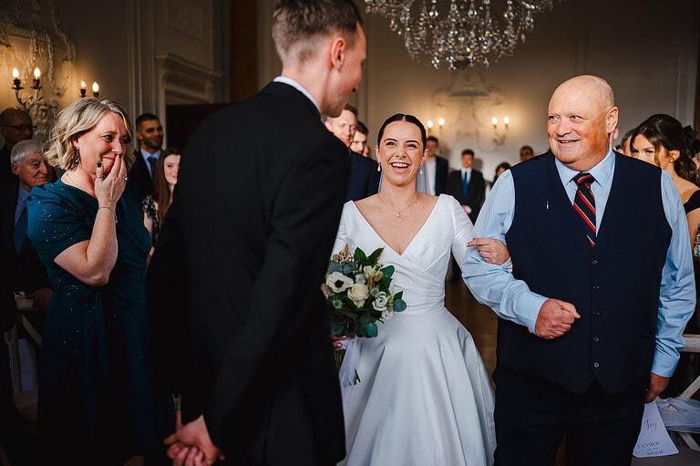 Bride and dad walking down the wedding aisle to an unplugged wedding ceremony