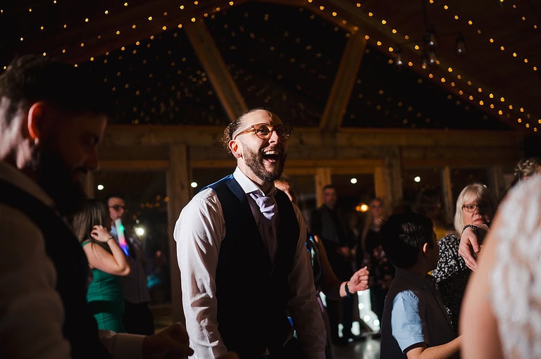 Wedding guest laughing on the dance floor