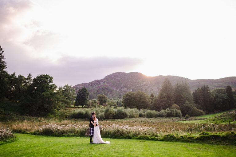 Couple portraits in Scotland with the mountains in the background