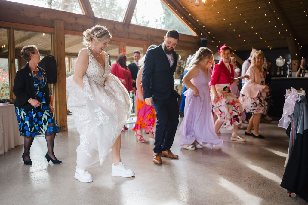 Bride and wedding guests dance at Chycara