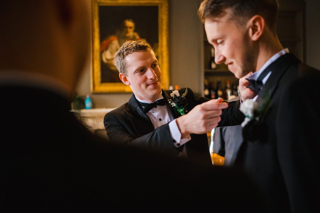 Groom and his party getting ready to celebrate the grooms wedding at Rockbeare Manor