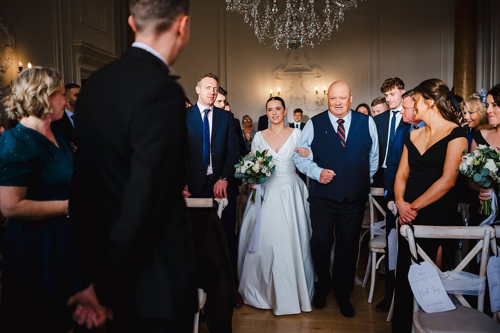 Walking down the aisle at Rockbeare Manor Wedding Venue
