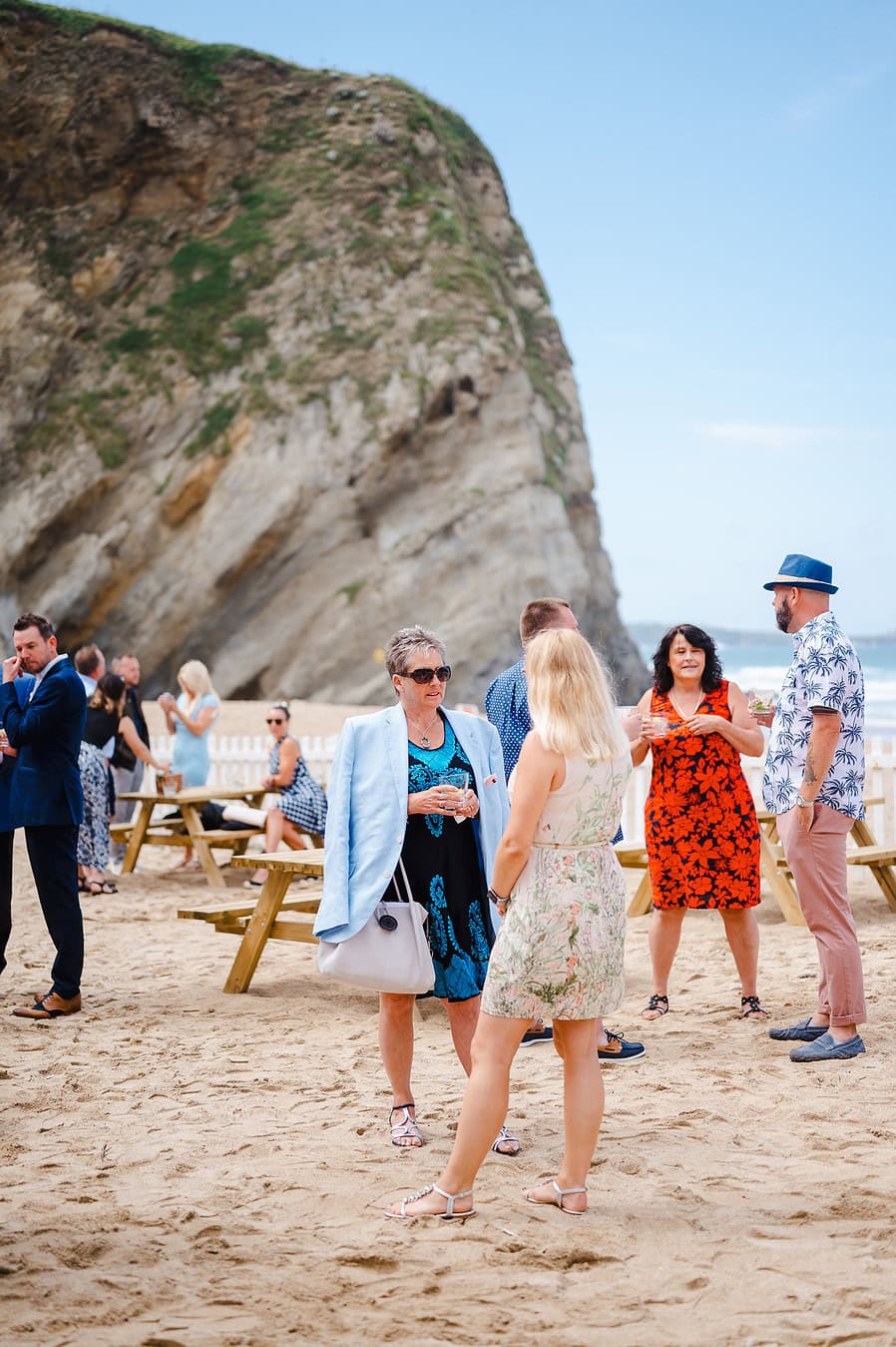 Wedding guests chatting and laughing at a lusty glaze wedding
