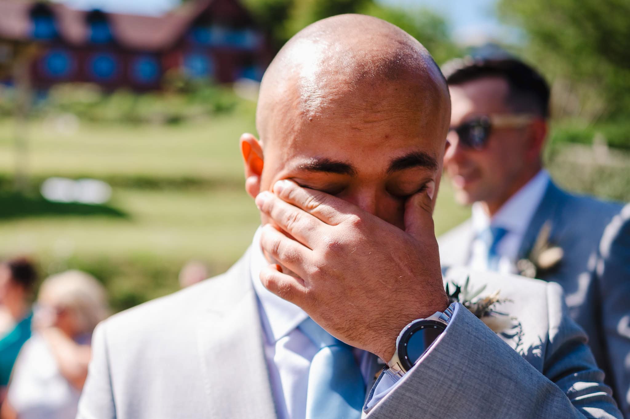Groom getting emotional as the bride walks down the aisle