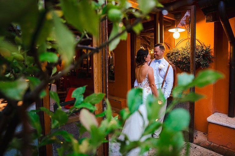 Couple laughing during their couple photos on their wedding day