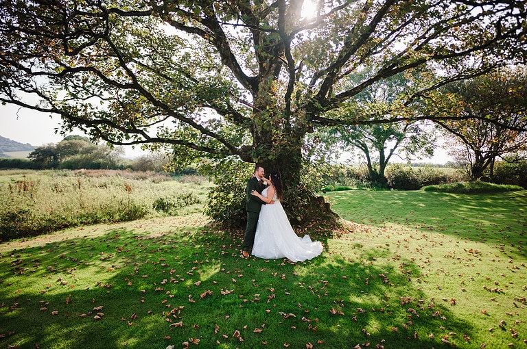 Take a moment to stop and look into each others eyes underneather a large tree