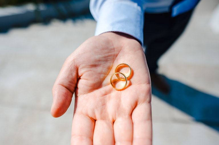 Wedding rings being held in the hand