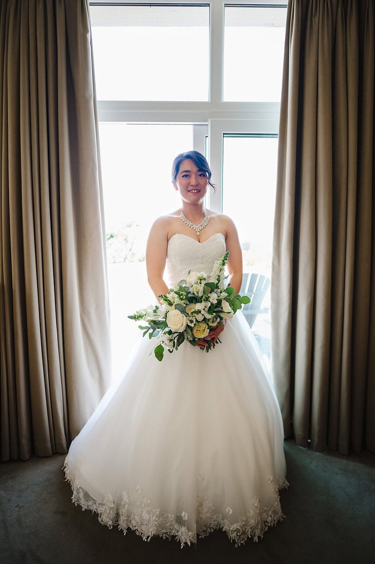 Bride dressed up in her beautiful white wedding dress