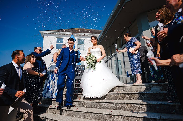 Flower Confetti against the bright blue sky outside the polurrian