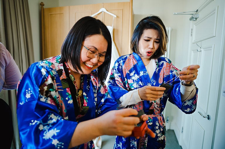 Bridesmaids getting the brides jewellery ready