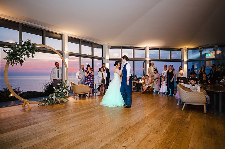 First dance at Polurrian On The Lizard with the sunset in the background