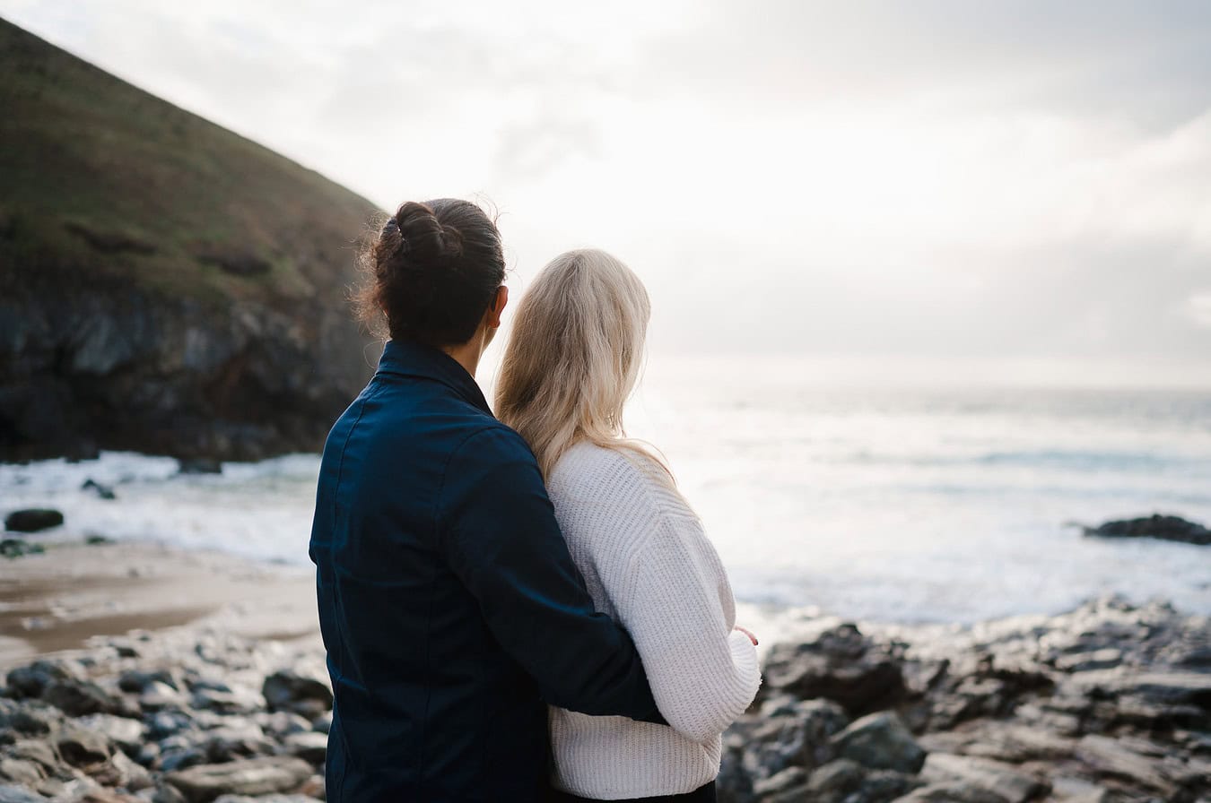 Taking in just how beautiful this spot in Cornwall is. A stunning place made to watch the sunset by Cornwall Engagement Photographer, by Jake Timms Photography