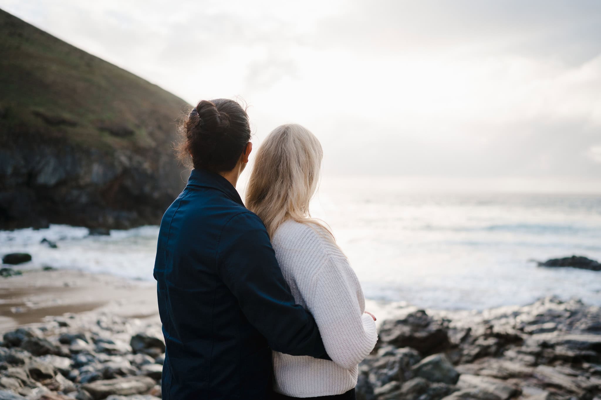 Taking in just how beautiful this spot in Cornwall is. A stunning place made to watch the sunset by Cornwall Engagement Photographer, by Jake Timms Photography
