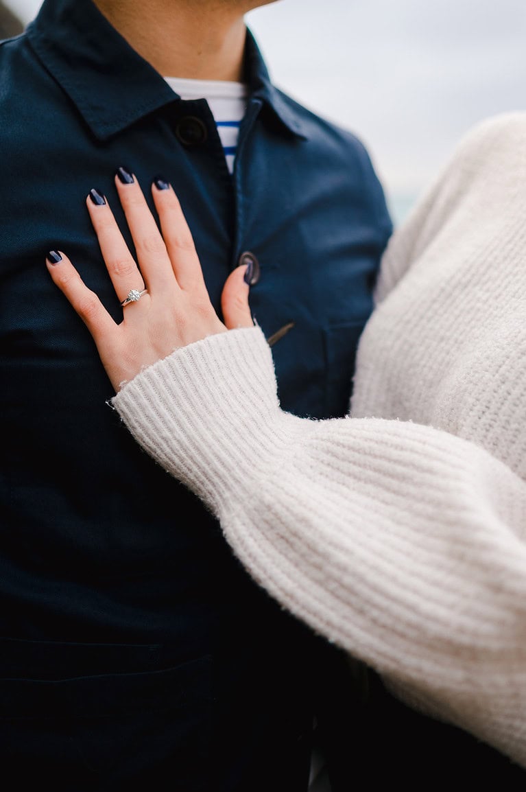 A beautiful engagement ring placed on her hand