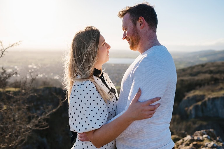 Looking into each others eyes as the warm golden sunshine shines upon the happy newly engaged couple