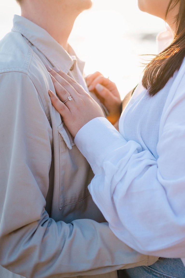 Showing off the engagement ring during the couples Sandymouth engagement photo shoot by Cornwall engagement photographer, Jake Timms Photography