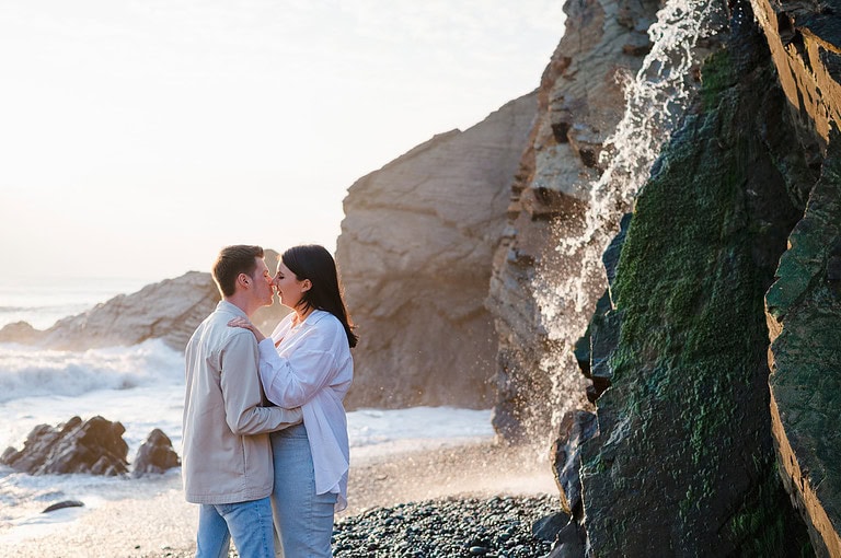 If in doubt kiss it out. WHat a beautiful place to share a kiss during this happy newly engaged couples photo shoot