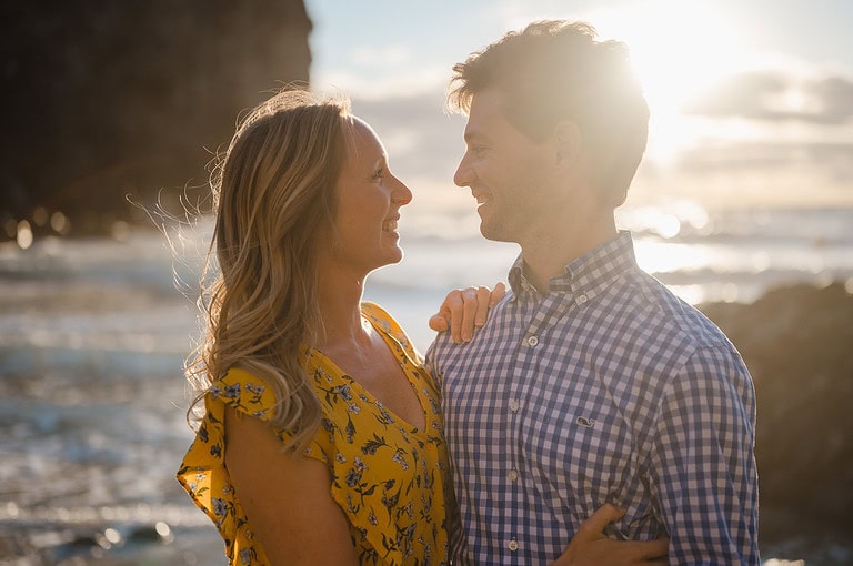 Up close as the happy couple look lovingly into each others eyes as the waves crach behind them at Wheal Coates. By Cornwall Engagement Photographer, Jake Timms Photography