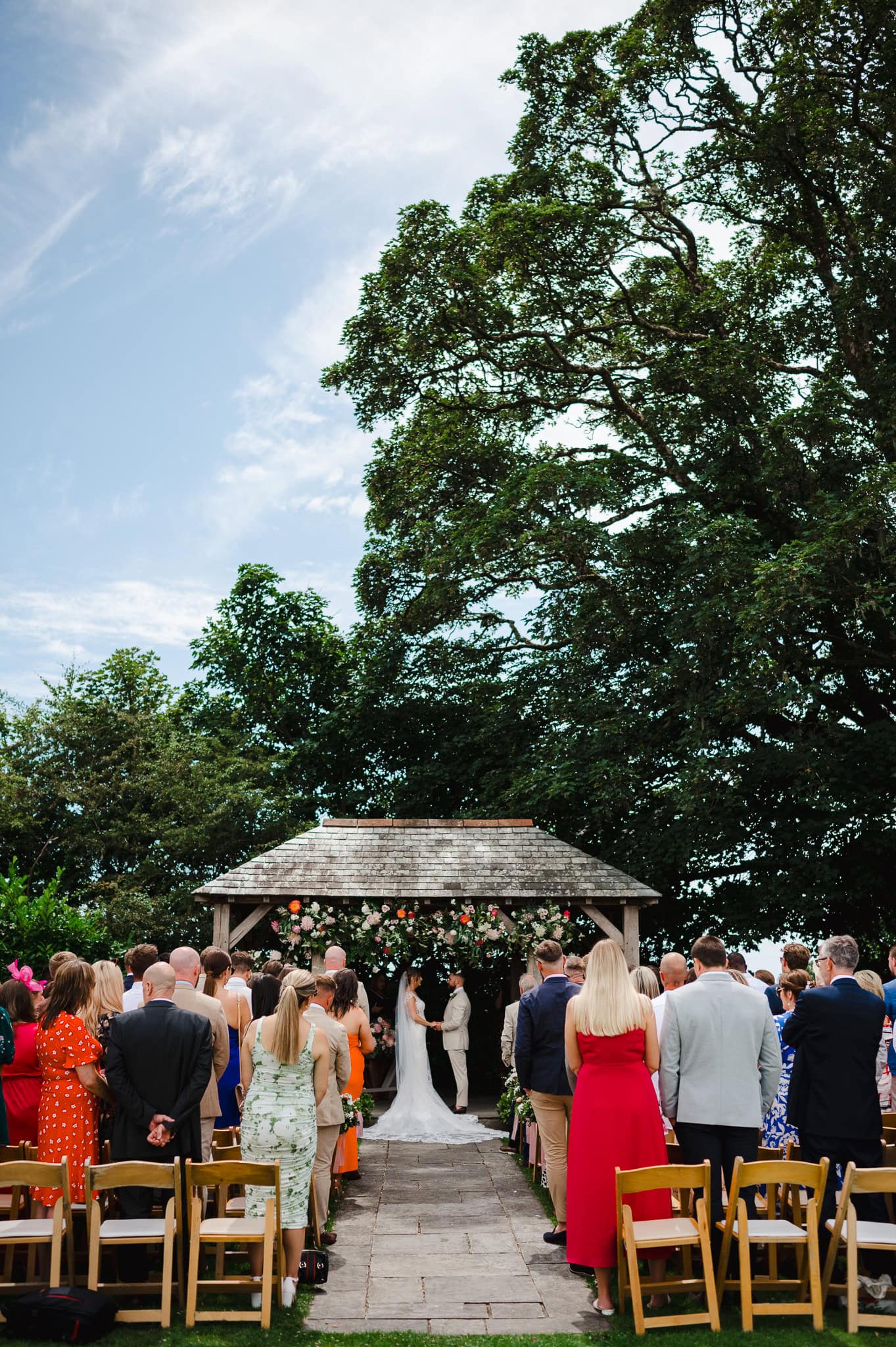 Wedding couple saying their wedding vows at their outdoors wedding ceremony by Bath Wedding Photographer, Jake Timms Photography