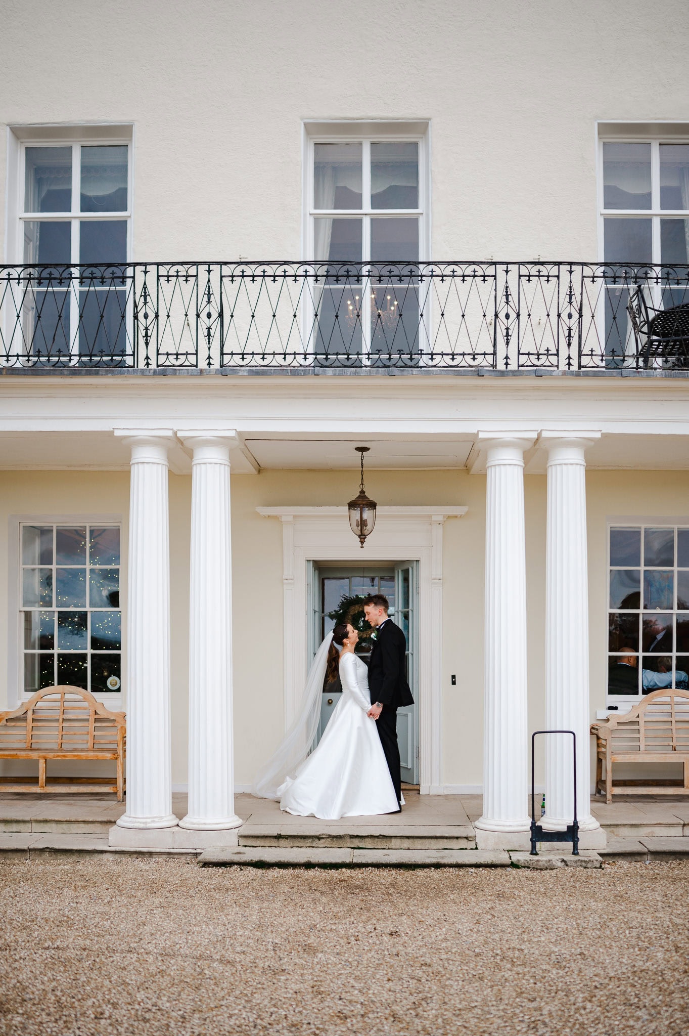 Wedding couple stand and face each other outside of Rockbeare Manor by Exeter Wedding Photographer Jake Timms Photography