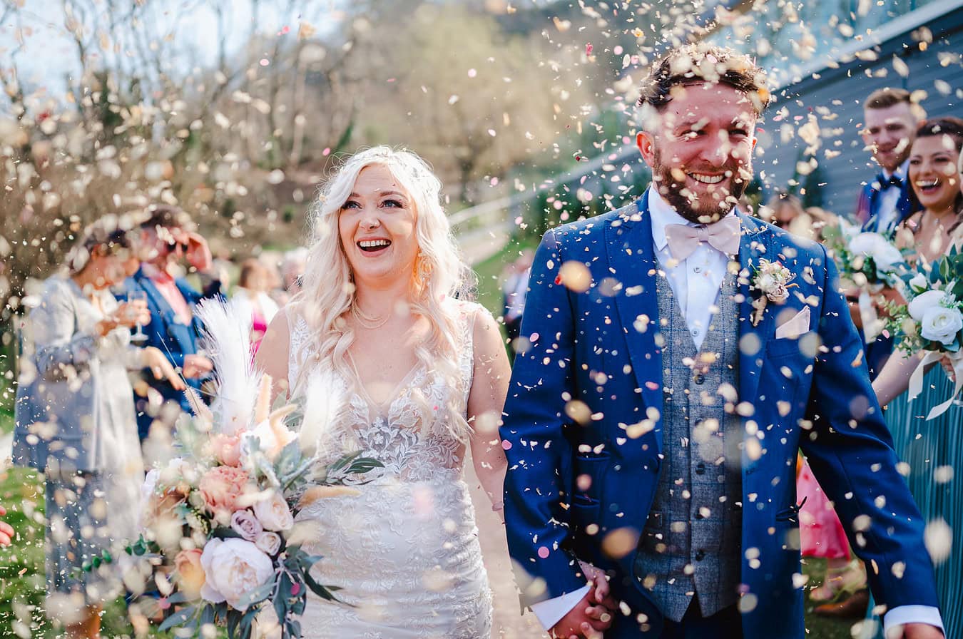 Wedding Confetti covering the bride and groom by Exeter Wedding Photographer Jake Timms Photography