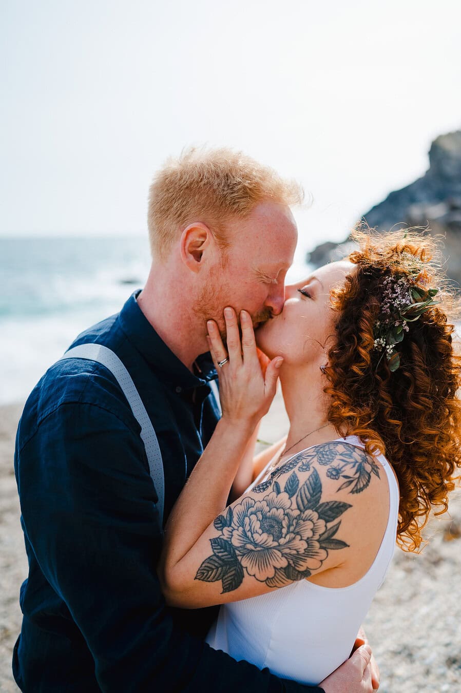 Couple lovingly kiss eachother on their elopement wedding day in Cornwall