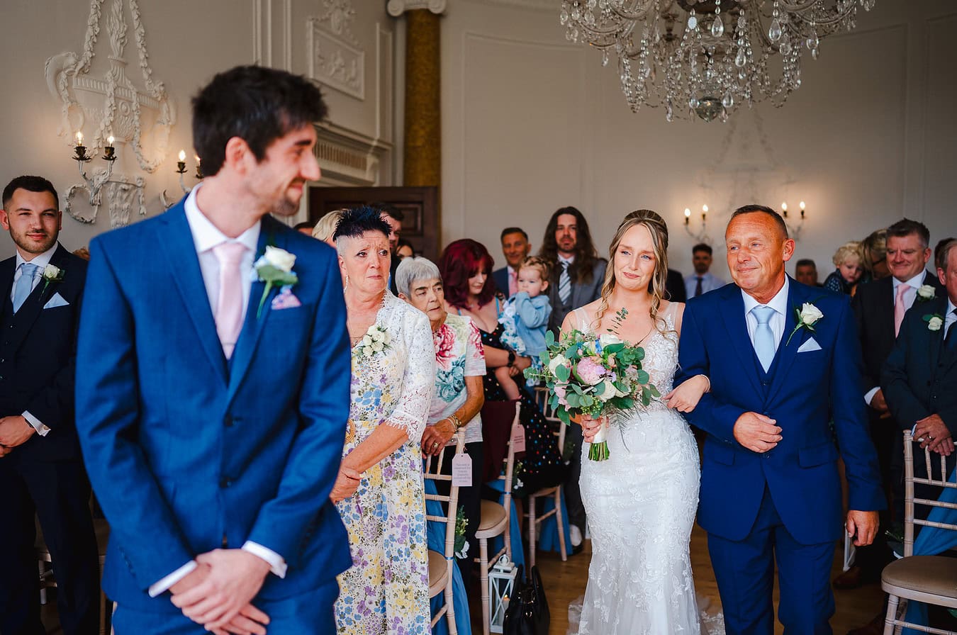 Bride walking down the wedding aisle at Rockbeare manor