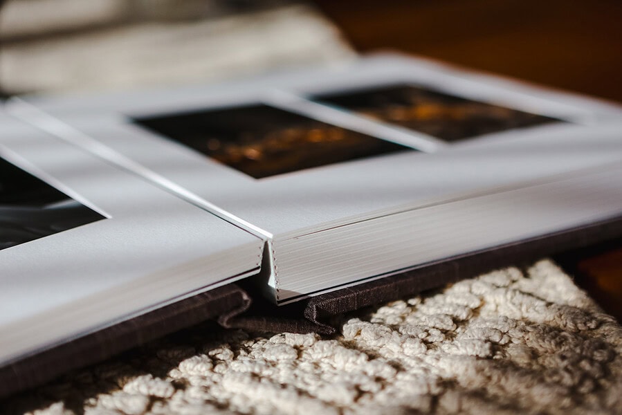 An open page looking at a Matted wedding album offered by Jake Timms Photography