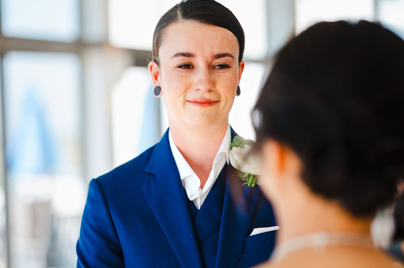 Emotions run high and tears start to run as she looks at her partner during their wedding ceremony