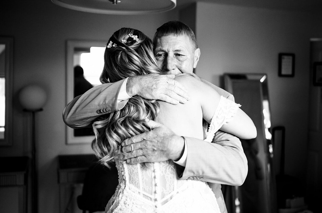 Everyone needs a hug on their wedding day.