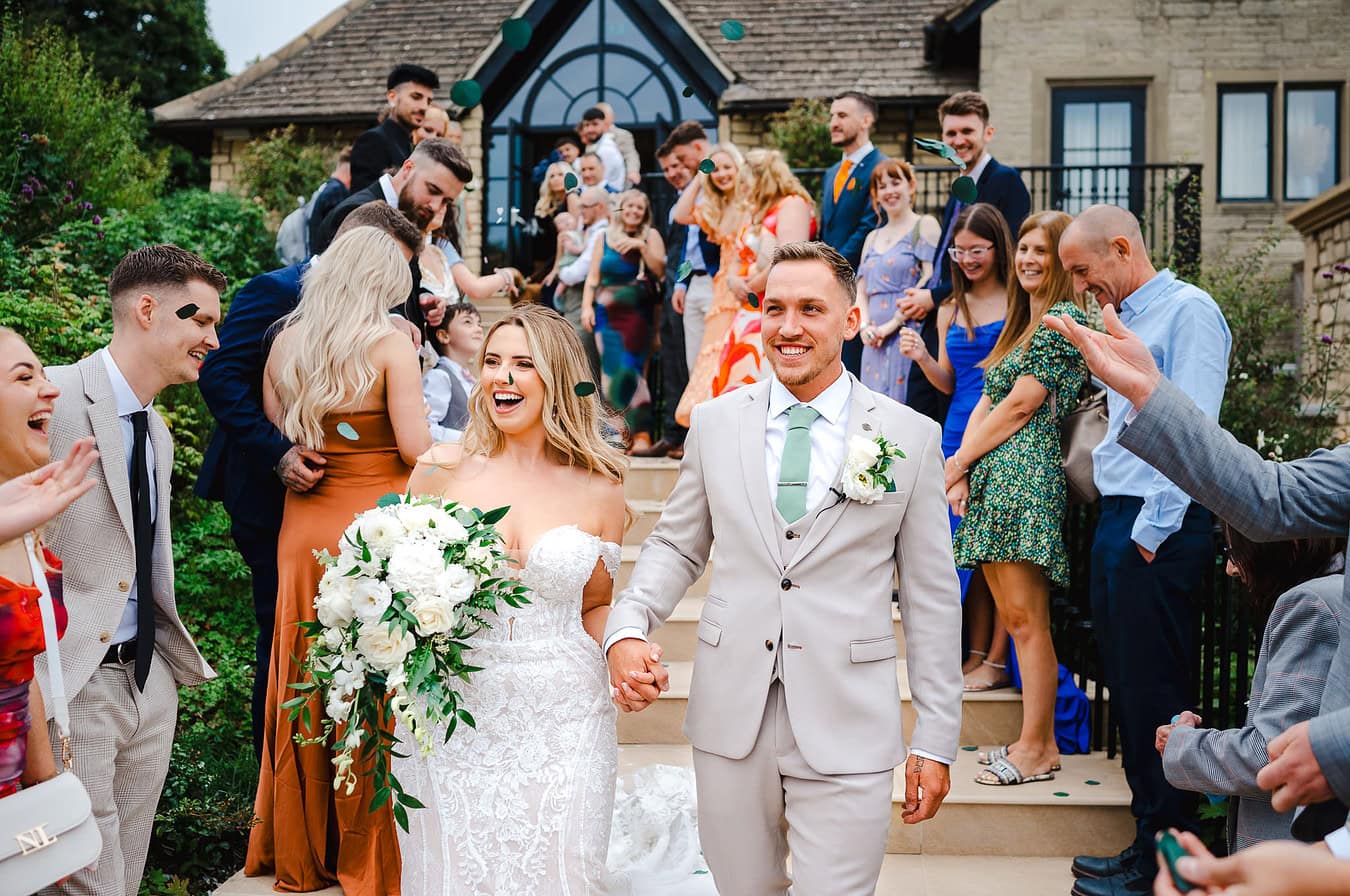 Couple just married at The Pear Tree in Purton walks down the steps down their wedding confetti aisle - Wedding Portfolio