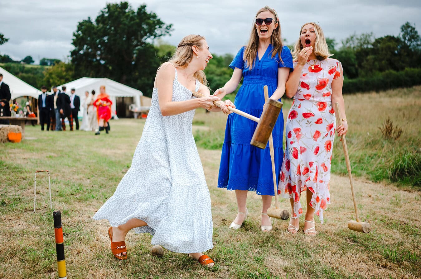 Missing the ball playing croquet on their wedding day